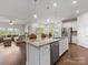 Open-concept kitchen and living area, with an eat-in island and abundant light at 7642 Porrera St, Charlotte, NC 28214