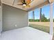 Covered patio with ceiling fan, painted siding, and view of a well-maintained lawn at 7642 Porrera St, Charlotte, NC 28214