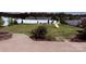 Spacious backyard with a stamped concrete patio, fire pit, and a swing set for children at 79044 Ridgehaven Rd, Lancaster, SC 29720