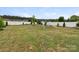 Large backyard with a white fence and playset, perfect for outdoor activities and Gathering fun at 79044 Ridgehaven Rd, Lancaster, SC 29720