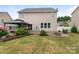 Spacious backyard features a patio, fire pit, lush lawn, and manicured landscaping, ideal for outdoor enjoyment at 79044 Ridgehaven Rd, Lancaster, SC 29720