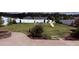 Spacious backyard with a white fence, swing set, and a stone fire pit at 79044 Ridgehaven Rd, Lancaster, SC 29720