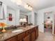 Spacious bathroom with double sinks, granite counters, tile floors, and decorative lamps at 79044 Ridgehaven Rd, Lancaster, SC 29720