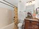 Well-lit bathroom with tub-shower combo, single vanity with granite counters and tile flooring at 79044 Ridgehaven Rd, Lancaster, SC 29720