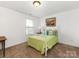 Bright bedroom features natural light, neutral carpet and a decorative bed at 79044 Ridgehaven Rd, Lancaster, SC 29720