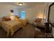 Bedroom featuring two beds with a chair between them at 79044 Ridgehaven Rd, Lancaster, SC 29720