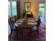 Traditional Dining Room with wood table, window view, and sliding door access to patio at 79044 Ridgehaven Rd, Lancaster, SC 29720