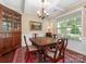Formal dining room with a classic chandelier, wood table, and a hutch at 79044 Ridgehaven Rd, Lancaster, SC 29720