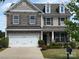 Charming two-story home with stone accents, manicured landscaping, and a two-car garage at 79044 Ridgehaven Rd, Lancaster, SC 29720