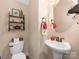 Cozy half bathroom featuring vanity sink and toilet at 79044 Ridgehaven Rd, Lancaster, SC 29720