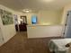 Open hallway with carpet floors, neutral walls, and access to multiple rooms at 79044 Ridgehaven Rd, Lancaster, SC 29720