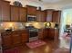 Well-equipped kitchen features wooden cabinets, granite counters and stainless steel appliances at 79044 Ridgehaven Rd, Lancaster, SC 29720