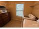 Functional laundry room with a front-load washer, dryer, and shelving for storage at 79044 Ridgehaven Rd, Lancaster, SC 29720