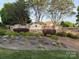 Walnut Creek neighborhood entrance with stone walls, lush landscaping, and colorful flowerbeds at 79044 Ridgehaven Rd, Lancaster, SC 29720