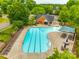 Aerial view of the community pool, lined with lounge chairs and framed by lush greenery at 8120 Calistoga Ln, Waxhaw, NC 28173
