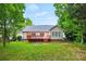 Back of house featuring a raised deck and a spacious yard at 8120 Calistoga Ln, Waxhaw, NC 28173