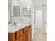 Bathroom featuring a vanity, and a doorway that leads to a walk-in closet at 8120 Calistoga Ln, Waxhaw, NC 28173