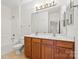 Bathroom featuring double sink vanity and tiled floors at 8120 Calistoga Ln, Waxhaw, NC 28173