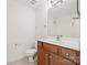 Bathroom featuring a vanity, toilet, and shower with a large mirror at 8120 Calistoga Ln, Waxhaw, NC 28173