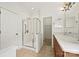 Bathroom featuring a glass shower, double sinks, walk-in closet and tile floor at 8120 Calistoga Ln, Waxhaw, NC 28173