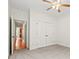 Bedroom featuring neutral carpet, closet, and view into the hallway at 8120 Calistoga Ln, Waxhaw, NC 28173