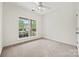 Light-filled bedroom featuring neutral carpet, large window and plenty of space at 8120 Calistoga Ln, Waxhaw, NC 28173