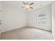 Bright bedroom with carpet, ceiling fan, and natural light from the window at 8120 Calistoga Ln, Waxhaw, NC 28173