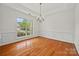 Elegant dining room featuring hardwood floors, crown molding, and large windows at 8120 Calistoga Ln, Waxhaw, NC 28173