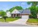 Charming brick front home with an attached garage and well-manicured lawn at 8120 Calistoga Ln, Waxhaw, NC 28173