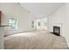 Bright living room with vaulted ceilings, a fireplace, and plenty of natural light at 8120 Calistoga Ln, Waxhaw, NC 28173