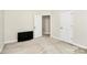 Bright bedroom with neutral carpet, two closets, and access to another room at 8200 Park Vista Cir, Charlotte, NC 28226