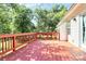 Back deck with wooden flooring featuring railings and views of the home's exterior at 8200 Park Vista Cir, Charlotte, NC 28226