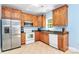 Well-appointed kitchen with stainless steel appliances, wood cabinets, and neutral countertops at 8200 Park Vista Cir, Charlotte, NC 28226