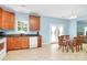 Functional kitchen with wood cabinets, stainless appliances, and a view of the dining area at 8200 Park Vista Cir, Charlotte, NC 28226