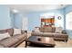 Inviting living room with neutral tones, comfortable sofas, and a view into the kitchen at 8200 Park Vista Cir, Charlotte, NC 28226