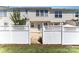 Backyard featuring a white picket fence and a grassy lawn, perfect for outdoor activities at 827 Gentlewinds Ct, Fort Mill, SC 29708