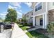 Exterior elevation showing manicured landscaping and convenient parking for the townhomes at 827 Gentlewinds Ct, Fort Mill, SC 29708