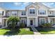 Charming townhouse showcasing a stone facade and well-manicured landscaping at 827 Gentlewinds Ct, Fort Mill, SC 29708