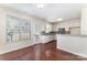 Bright kitchen with white cabinetry, stainless steel appliances, and hardwood floors at 827 Gentlewinds Ct, Fort Mill, SC 29708