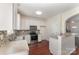 Modern kitchen showcases stainless steel appliances, tiled backsplash, and a breakfast bar at 827 Gentlewinds Ct, Fort Mill, SC 29708