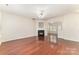 Spacious living room featuring a fireplace and seamless transition to the kitchen at 827 Gentlewinds Ct, Fort Mill, SC 29708
