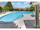 Community pool with lounge chairs and tables, perfect for relaxation and outdoor enjoyment at 827 Gentlewinds Ct, Fort Mill, SC 29708
