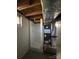 Unfinished basement featuring an HVAC unit and full shower stall at 8588 Smith Rd, Kannapolis, NC 28081