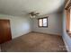 Spacious bedroom with neutral tones, natural light, and classic finishes at 8588 Smith Rd, Kannapolis, NC 28081