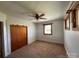 Bright bedroom featuring carpet flooring and a large closet at 8588 Smith Rd, Kannapolis, NC 28081