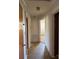 Hallway view with tile flooring and neutral paint at 8588 Smith Rd, Kannapolis, NC 28081