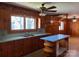 Cozy kitchen featuring wood cabinetry, a center island, and ample natural light at 8588 Smith Rd, Kannapolis, NC 28081