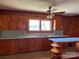 Cozy kitchen featuring wood cabinetry, a center island, and ample natural light at 8588 Smith Rd, Kannapolis, NC 28081