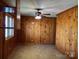 Inviting living room with classic wood walls and abundant natural light at 8588 Smith Rd, Kannapolis, NC 28081