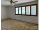 Open living room with large window and plush carpeting at 8588 Smith Rd, Kannapolis, NC 28081